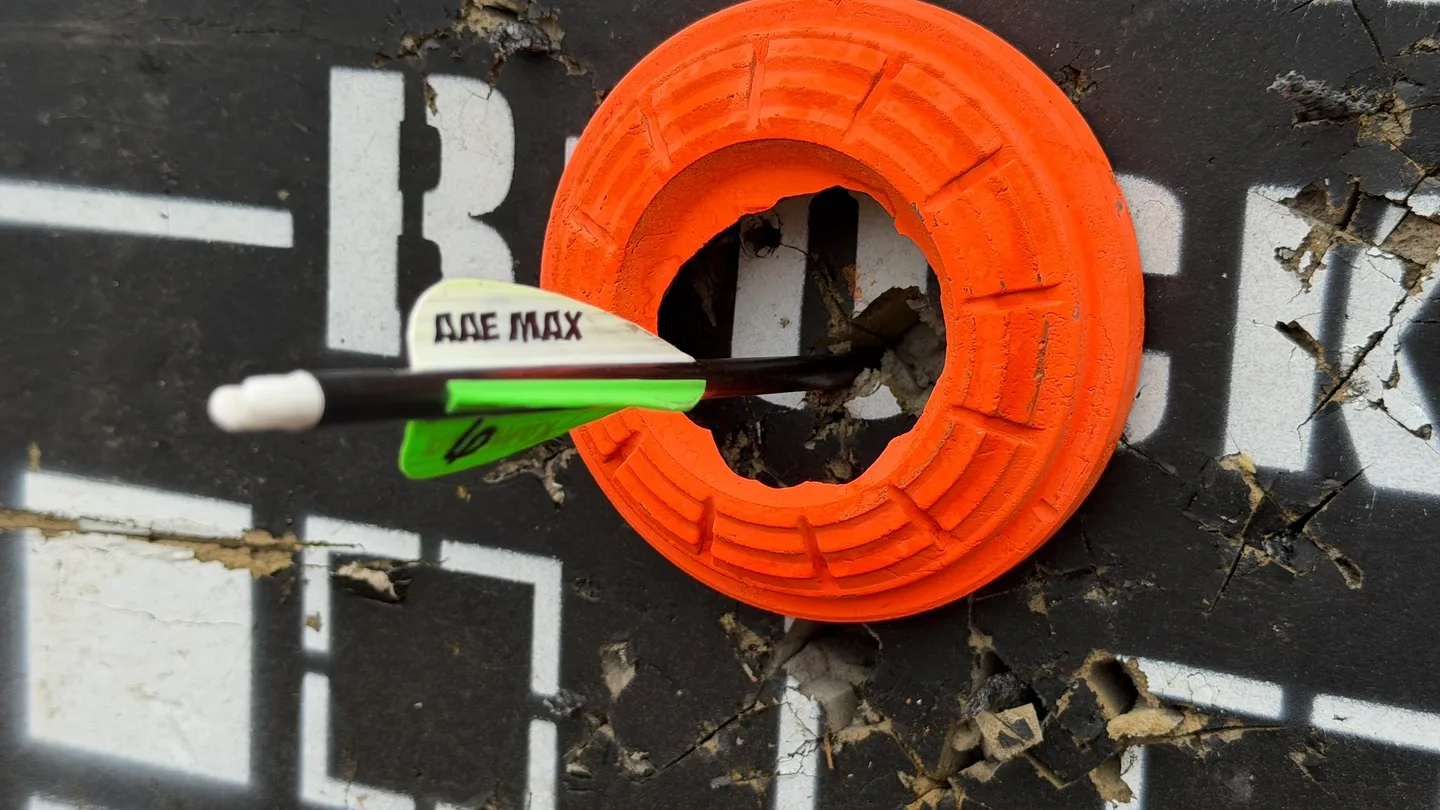 Arrow hitting the bullseye on a target.