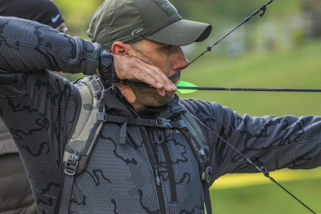 Competitors Ryan Havlicek at full draw during the Appalachian Bowhunter Challenge head-to-head bracket at Winterplace Ski Resort West Virginia