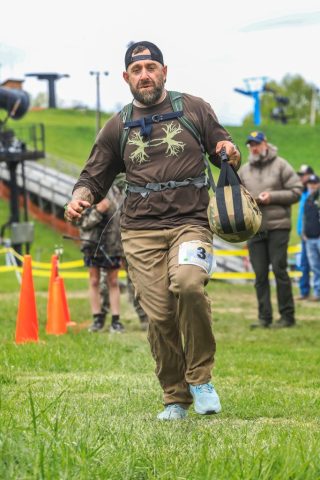 Competitor Daniel Clower mid race carrying a sand bag during the Head-to-Head event at the 2026 Applachian Bowhunter Challenge